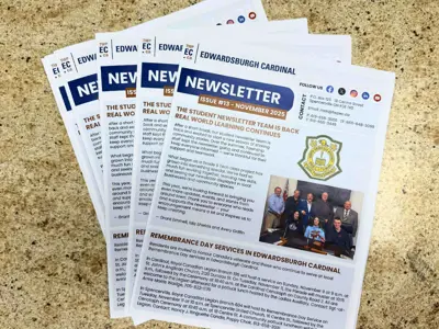 Stack of printed copies of the Township of Edwardsburgh Cardinal’s November 2025 community newsletter laid out on a tan countertop. The front page highlights the student newsletter team’s return, Remembrance Day services, and a photo of council members with students.